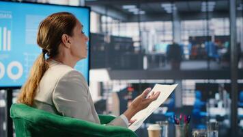 Office meeting highlighting leadership and business planning for a new partnership between powerful people using metrics and strategy to drive performance and development. Camera B. video