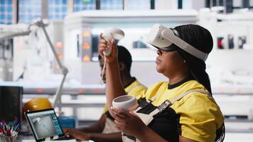 Photovoltaics factory engineer using VR tech to build models of alternative energy generators. Solar panels plant female employee building safe solar cells using virtual reality gear. Camera A. video