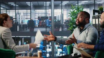 Office life showing frustration and dispute during a business discussion, with leaders are facing disagreement and workplace tension in a multicultural goal oriented company. Camera B. video