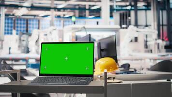 Green screen display on computer used to help in photovoltaics factory system parameters. Chroma key mockup pc used for optimizing energy supply in solar panel manufacturing plant, eco friendly. video