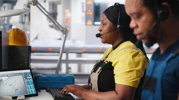 Engineer provides technical support via headset in solar panel factory, operator assists customers with solar equipment issues. Ensuring efficient communication on the helpline. Camera A. video