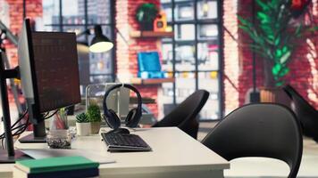 Digital workstation features multiple PC monitors running artificial intelligence and deep learning code. Empty high tech space supports cloud computing, data science and self learning systems. video