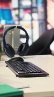 Vertical Empty AI developer desk including a monitor filled with neural network data, highlighting cloud computing, network connectivity and pattern recognition in scientific research. Notes tree. video