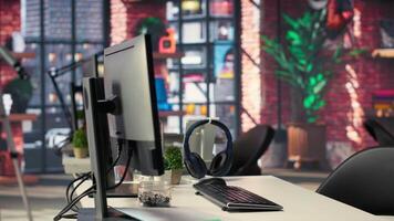 Modern desktop setup in an IT agency shows a visual coding interface with deep learning algorithms. System displays neural networks and AI brain models used in machine learning development. video