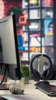 Vertical Modern desktop setup in an IT agency shows a visual coding interface with deep learning algorithms. System displays neural networks and AI brain models used in machine learning development. video