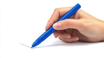 Hand holding blue pen creating a line on blank paper in a bright, minimalistic space during daytime photo