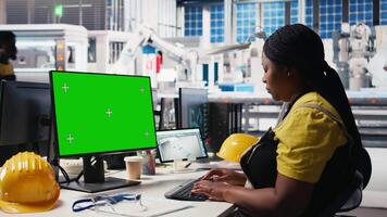 Photovoltaics facility worker reviews data on green screen computer to improve production, eco friendly solar energy. Solar panels plant expert identifying system errors using mockup PC. Camera B. video