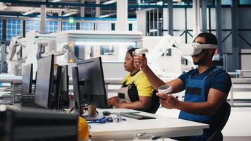 African american technician in solar panels plant using VR goggles, optimizing layouts using CAD software. Photovoltaics factory worker using virtual reality tech to do arrangements. Camera B. video