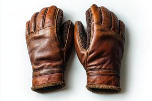 Classic brown leather gloves displayed on a white surface with intricate details and texture photo