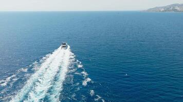Small Yacht Travels In Ocean Near Coast Aerial View video