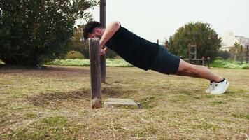 Man Does Push Ups Sport Exercise In The Park Using The Iron Bar video