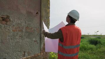 Architect Opening And Reading The Project Document At The Construction Site video