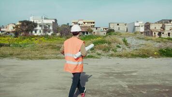 Engineer With Helmet Going Towards The Building To Rebuild video