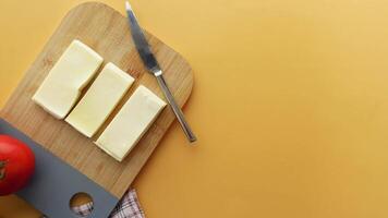 top view of slice of cheese on a chopping board video