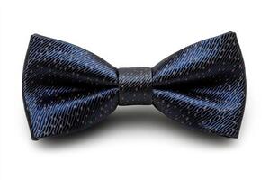 Classic navy blue bow tie with intricate pattern displayed on a plain background photo