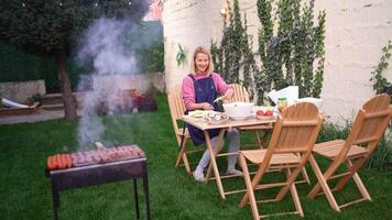 Preparation for a delightful barbecue gathering in a cozy backyard oasis video