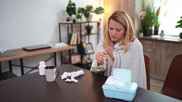 Feeling unwell in a cozy home environment while wrapped in a blanket during the chilly season video