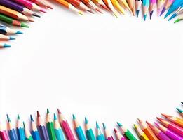 A beautiful row of colourful pencils are arranged in a circle on a white background photo