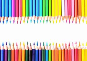 A row of coloured pencils are lined up in a row photo