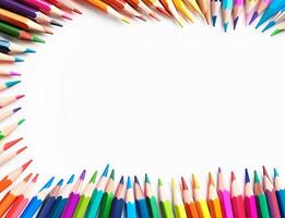 A row of colourful pencils are arranged neatly in a circle on a white background photo