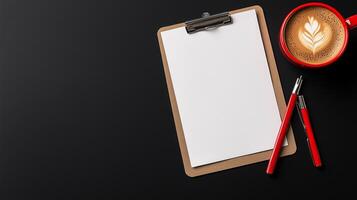 Elegant Workspace with Clipboard, Red Pens, and Coffee on Black Background photo