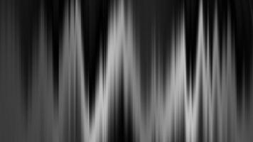 Blurred abstract vertical lines in black and white. Suitable for backgrounds, overlays, designs, and artistic projects needing a modern touch. video