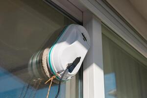 modern automatic device, vacuum robot window cleaner photo