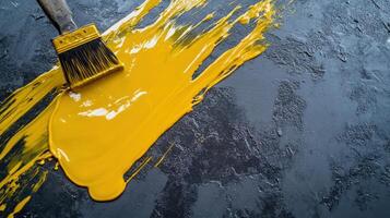 A brush of artistic creativity, bold yellow paint streaks on textured gray canvas, highlighting dynamic contrast and artistic expression. Workers painting epoxy resin floor photo