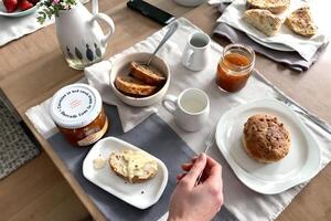 cottagecore breakfast table with jam, bread, photo