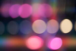 A blurry image of a group of colorful circles. The circles are of different sizes and colors photo