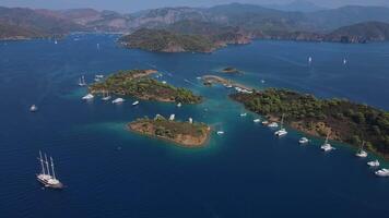 Seaside serenity boats nestled in turquoise cove calming ambiance of turquoise bay adorned with numerous boats. Perfect blend of nature and nautical life pristine coastal environment and peacefulness. video