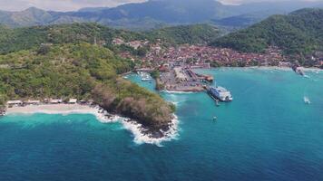 Ferry terminal and coastal town with turquoise waters in Lombok, Indonesia video