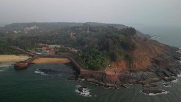 Aerial view of coastal fort and beach in Goa, India video