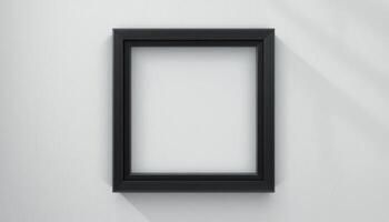 Empty black picture frame against a light background. photo