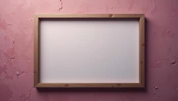 Empty light-colored picture frame on a textured pink wall. photo