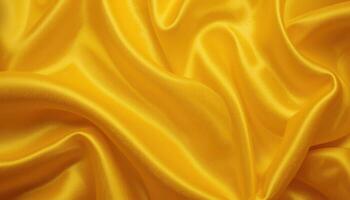 Golden yellow fabric's flowing folds and texture. photo