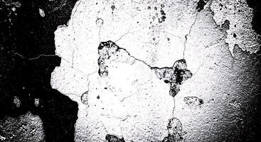 Black and white photo of a wall with peeling paint