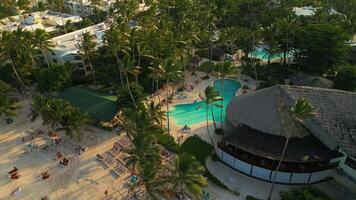 Aerial view of a tourist beach and hotel pool in Punta Cana video
