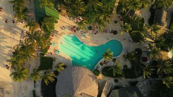 Aerial top view of a resort pool at sunset in Punta Cana video