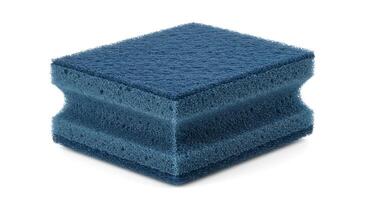 A blue sponge sitting on top of a white surface photo