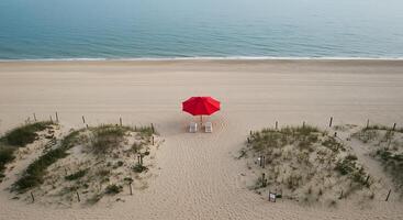 A red umbrella on the beach photo