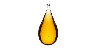 A yellow drop hanging from a white background photo