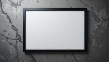 Empty black framed picture on textured gray wall. photo