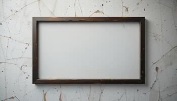 Empty picture frame, dark brown wood, against textured wall. photo