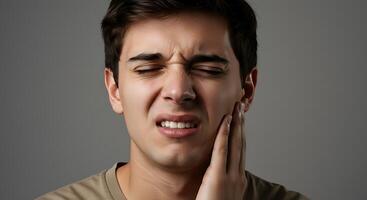 A man with his hand on his chin and his mouth open photo