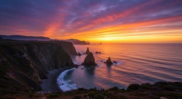 Sunset over the ocean with cliffs and rocks photo