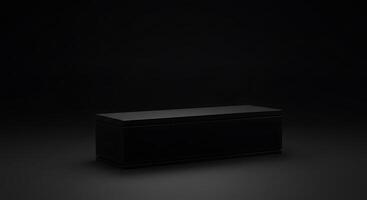 A black box sitting on a dark surface photo