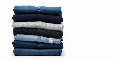 Stack of jeans on white background photo