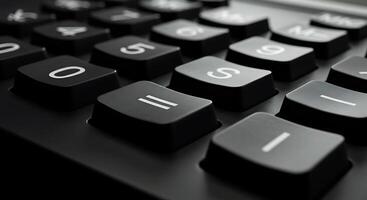A close up of a black calculator with numbers on it photo