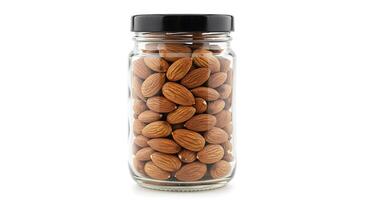 Almonds in a glass jar on a white background photo